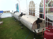Three hog roast machines